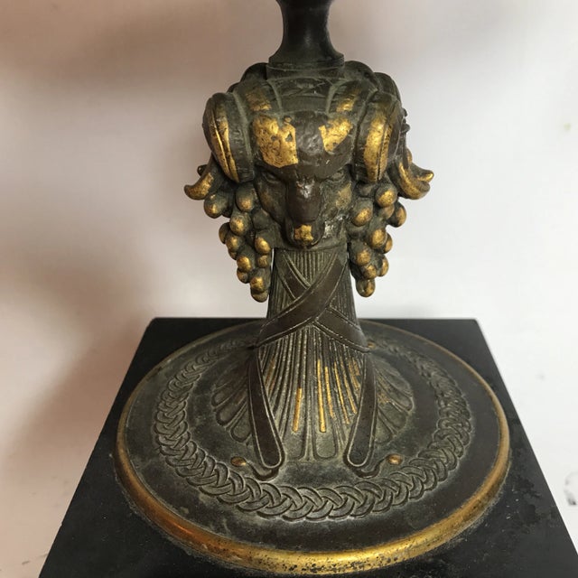 Two tone bronze compote with sentitious detailing. Features two ribbon shaped handles on either side of the pedestal bowl....