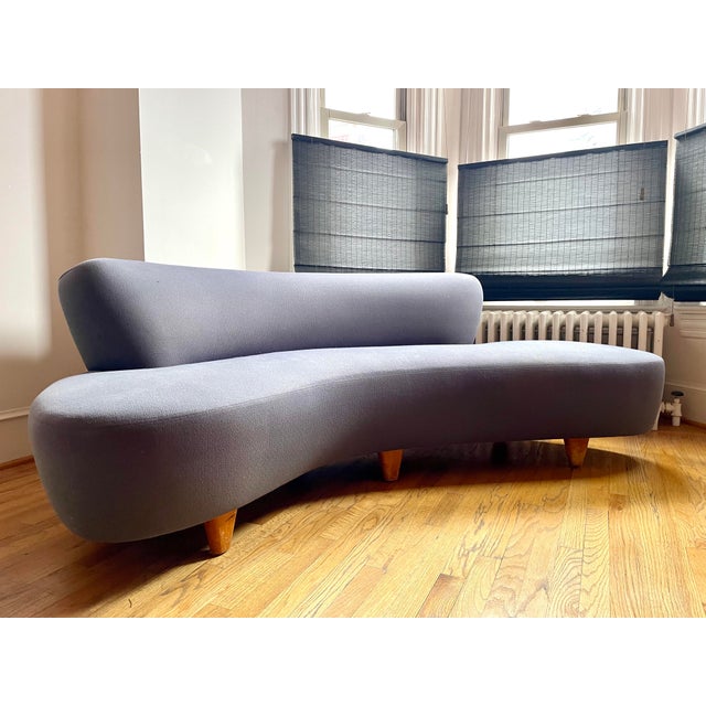 Designed by famed Mid-Century furniture designer Vladimir Kagan, this iconic "cloud" sofa features smooth elegant lines...