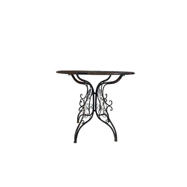 This refined vintage metal table exemplifies classical European design principles with its sophisticated French Provincial...
