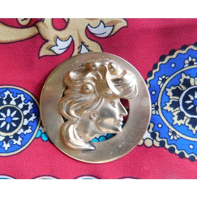 Vintage Art Nouveau large solid brass profile of a woman brooch, C. 1900. This authentic stunning round brass turn of the...