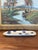This handmade studio pottery tray features an organic oval form with hand-rolled edges and a subtle cream glaze accented...