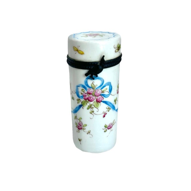An absolutely charming little French porcelain needle étui, beautifully hand-painted with delicate pink rose blossoms,...