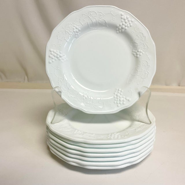 This set of 8 Milk Glass Dinner Plates are from the Colony Brand division of Indiana Glass Company. They feature a grape...