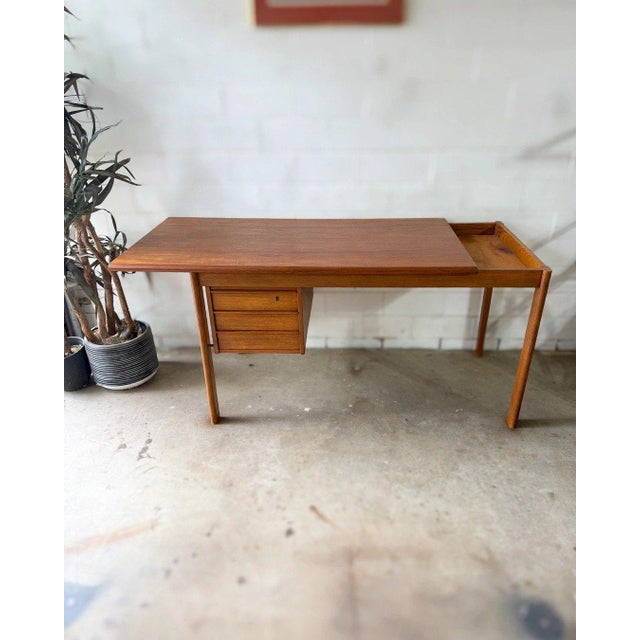 Vintage 1960s Danish modern teak desk by Løvig, stamped Løvig Dansk Design / Made in Denmark. Professionally refinished by...