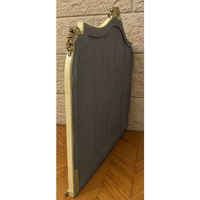 Large Louis XVI style mirror in lacquered and gilt wood, circa 1900 This important Louis XVI style mantel mirror features...