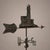 A rare copper weathervane from the early 1900s, featuring a three-dimensional composition depicting a harbor lighthouse....