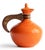 A beautifully detailed photograph of a vintage Bauer Pottery carafe, circa 1940, a classic example of warm, sculptural...