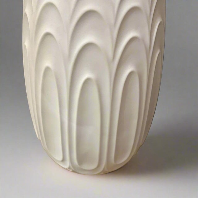 A large and tall Modernist bisque porcelain Heinrich brand vase from Germany circa 1960. The design of concentric ovals...