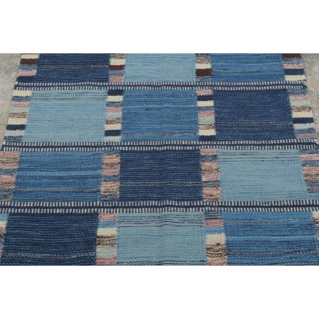 Handwoven in semi-worsted wool this 3x4 Scandinavian rug features a geometric plaid-inspired design in layered shades of...