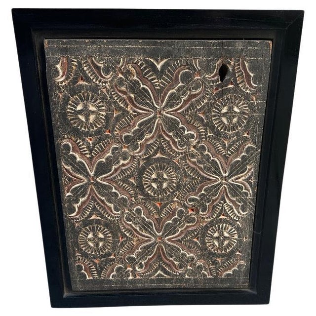Antique hand carved panel from Toraja. Framed in a minimalist black teak wood shadow box. This carving symbolizes peace...
