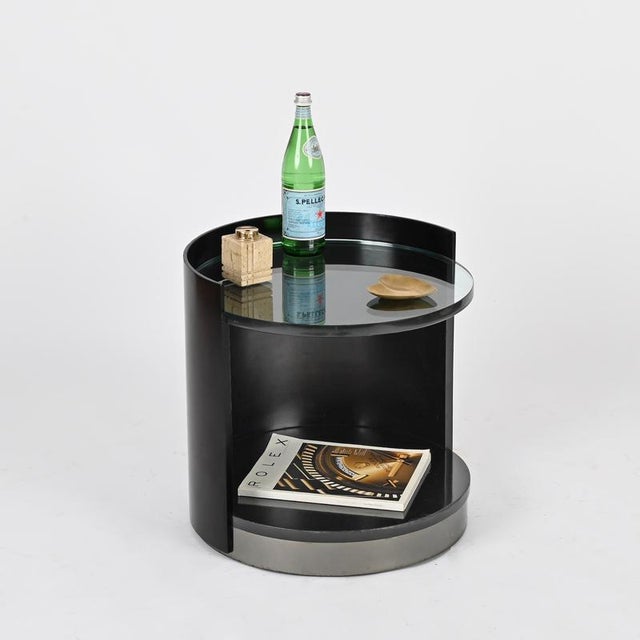 Marvelous and rare pair of nightstands in lacquered wood, crystal and stainless steel. This charming small tables were...