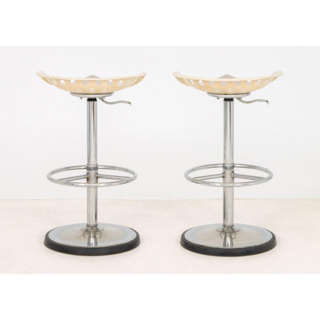 Pair of Etienne Fermigier (French, 1932-1973) for Mirima "Reaper" Adjustable Bar Stools, with white lacquered metal seats...