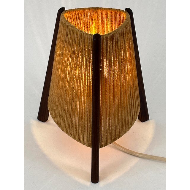 Extremely rare and lovely mid-century modern teak and sisal/raffia bedside table lamp. Designed and manufactured probably...