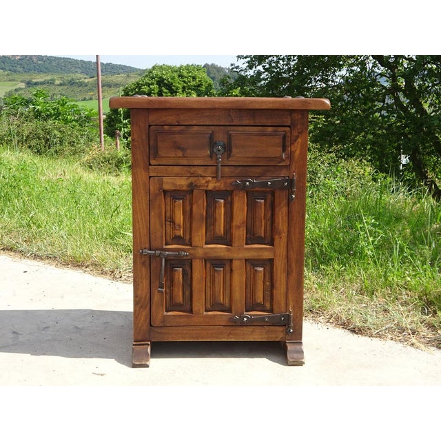 Small jam cupboard or large bedside table, entirely in solid oak with black wrought iron hardware and hinges. The 3 cm...