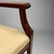 A De Coene Frères designed Art Deco period armchair from Belgium circa 1930. Beautiful hardwood with patinated bronze sabots.
