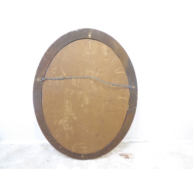 This large oval mirror measures 41.25"H x 31"W and is ready to hang vertically.