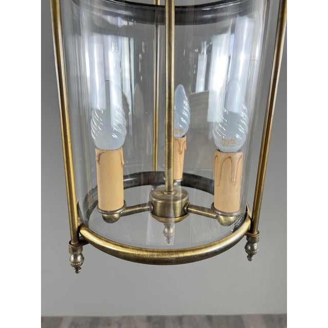 Elegant hanging lantern in a classic French style, crafted from brass with a simple and perfectly balanced structure. It...