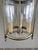 Elegant hanging lantern in a classic French style, crafted from brass with a simple and perfectly balanced structure. It...