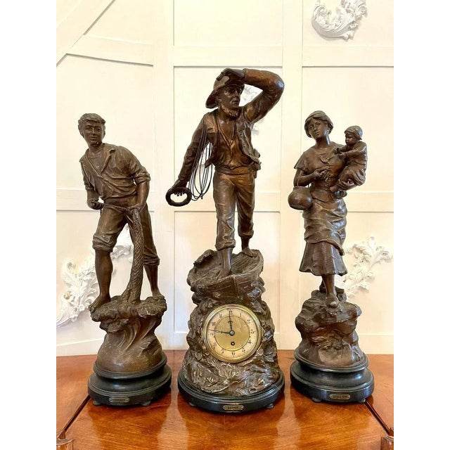19th century fine antique large french three piece clock set having a fisherman in period dress standing in a boat and...