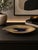 A sculptural mid-century West German pottery dish in an elegant elongated leaf form, finished in a deep brown-to-black...