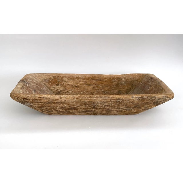 Large rustic Turkish dough bowl with a unique handle at one end. Age and utilitarian use has left this with distressed...