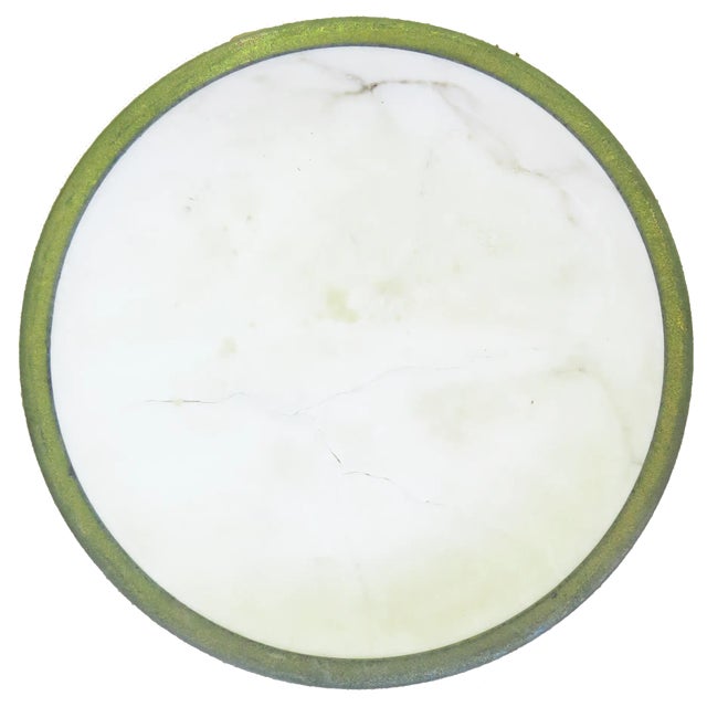 With its very Parisian pied-a-terre vibe, this vintage, creamy white marble wine coaster with brass edge weathered to a...