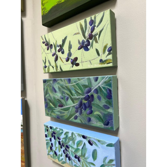 A 3-piece set of olive paintings, "A Handful," "On the Other Hand" and "Olive Sky" (available separately for $300 each).