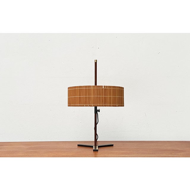 Very rare mid-century table lamp from the German manufacturer Kaiser Leuchten. The design impresses with its special...
