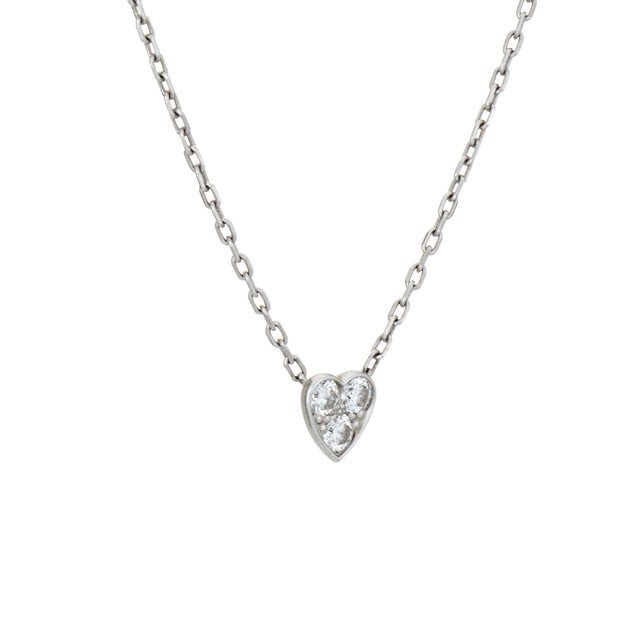Stylish and finely detailed pre-owned Cartier diamond heart necklace crafted in 18k white gold. Diamonds total an...