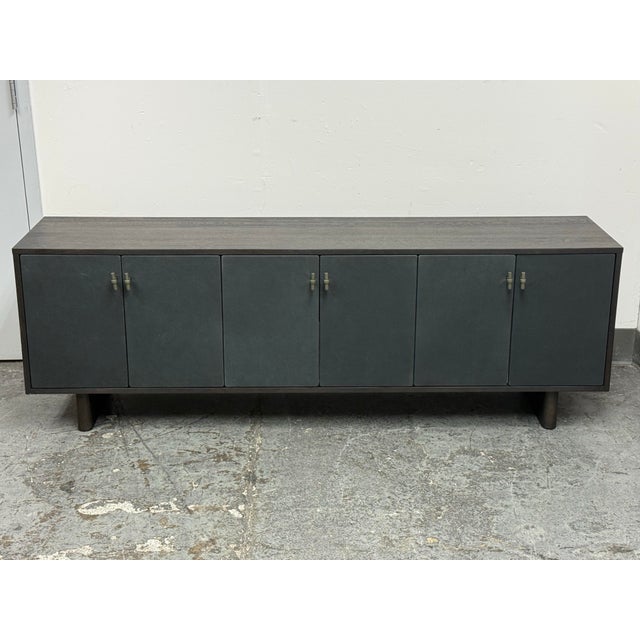 Design Plus Gallery presents the Posada Media Console from Four Hands. The rectangular cabinet combines thick oak veneer...