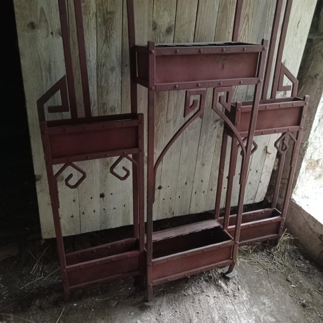 Very heavy metal coat rack, solid steel. It s been sanded and covered with priming coat. This piece is a great renovation...