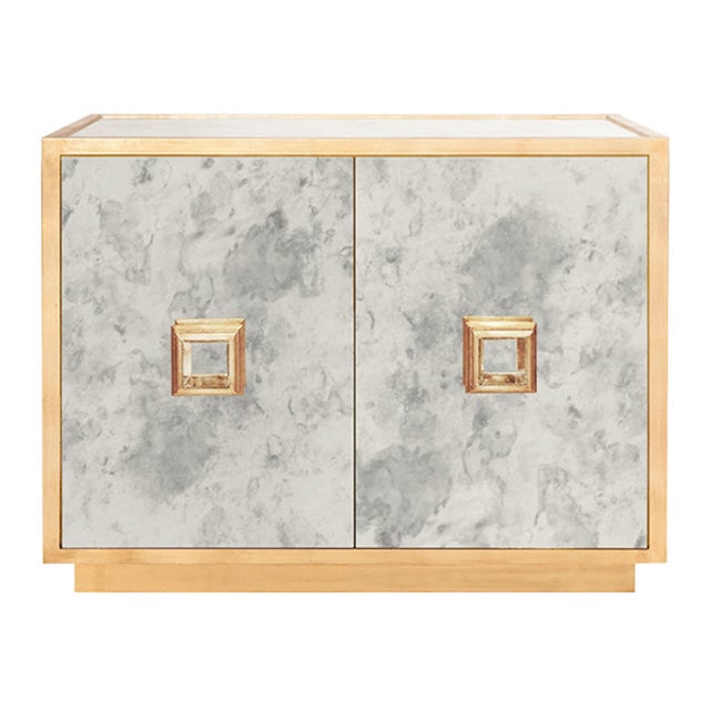 New special order item. Not vintage. The Worlds Away Winslow mirror cabinet delivers sleek modern style. Features a gold...