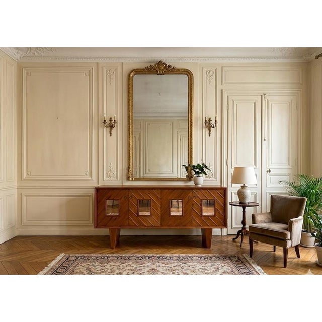 Elegant Mid-Century Italian Wooden Sideboard, Milan, 1940s This elegant mid-century Italian sideboard evokes the refined...