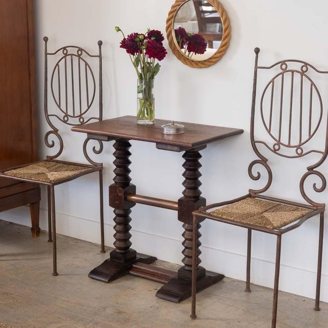 Beautiful carved wood side table by Charles Dudouyt from France, 1940s. Rectangular wood top on two carved legs with...