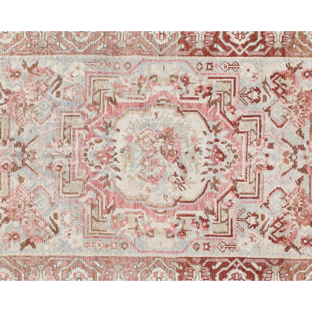 This semi-antique Melayer runner exemplifies traditional Persian craftsmanship, hand-woven with wool on a cotton...