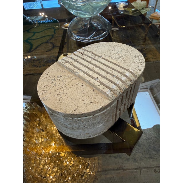 A sculptural oval travertine box produced by Fratelli Mannelli in Signa (Florence), Italy, during the 1970s. Carved from...