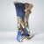 An Old Paris Porcelain Vase with a floral centerpiece theme and gilt detailing. 19th Century. As is typical with Old...