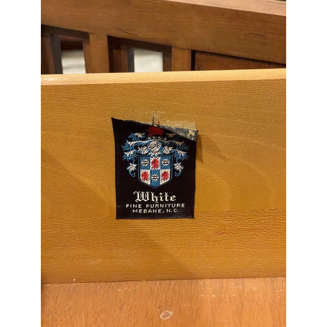 An exquisitely designed and flawlessly crafted Mid-Century modern solid walnut wood credenza by White Fine Furniture of...