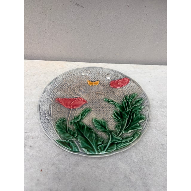 French Majolica Poppies & butterfly plate signed Gien, circa 1880.
