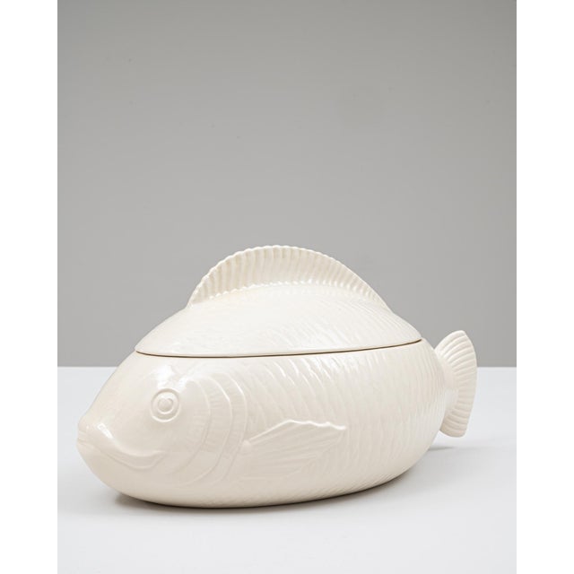 This 20th Century French special edition porcelain tureen is crafted in a striking fish form, offering both sculptural...