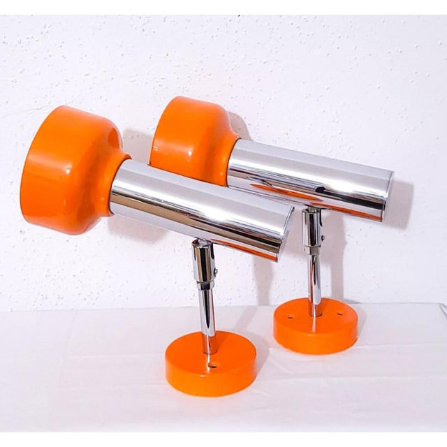 Mid-Century Desk or Wall Lamps in Orange and Chromed Metal, 1970s, Set of 2, in Very Good conditions. Designed 1970 to...
