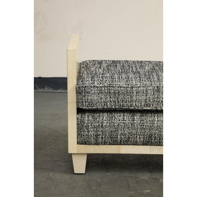 A contemporary 21st century pair of parchment benches in the style of Jean Michel Frank. Handsome midcentury silhouette...