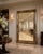 A spectacular oversized full-length mirror with commanding architectural presence and beautifully ornate detailing....