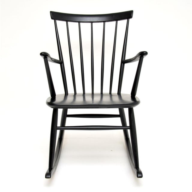 A stylish and extremely well made vintage Swedish rocking chair by Roland Rainer for Hagafors. It was was made in Sweden,...