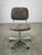 A refined Italian Mid-Century Modern office chair produced during the 1970s, combining minimalist styling with practical...