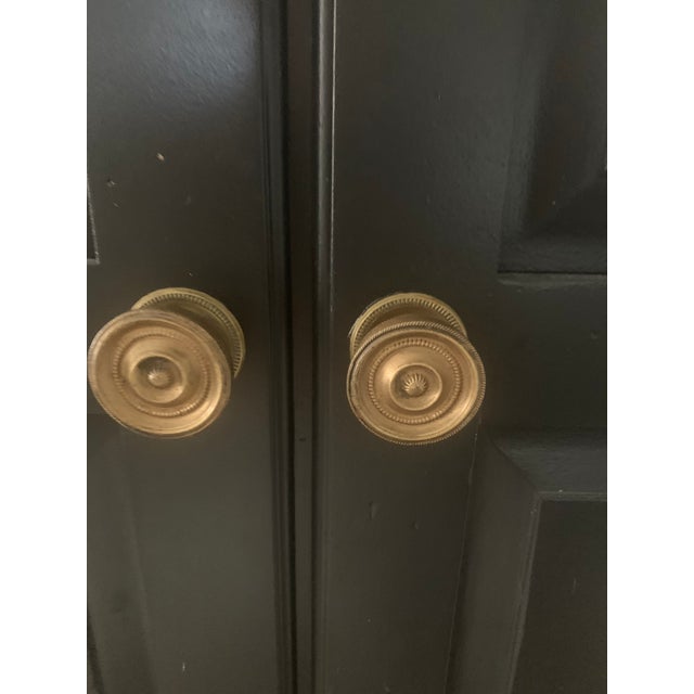 Inspired by a New England antique, this corner china cabinet by Ethan Allen is an impressive style statement. With...