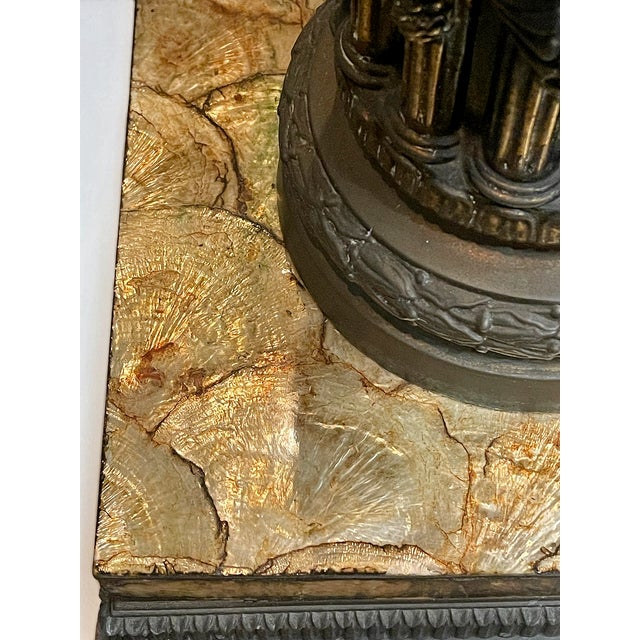 An extraordinary vintage 1960’s Hollywood Regency illuminated accent table showcasing an intricate blend of architectural...
