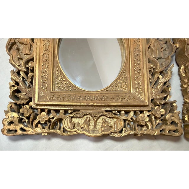 Up for sale is a pair of antique ornate hand carved Chinese gilt-wooden wall mirrors. These stunning frames feature...