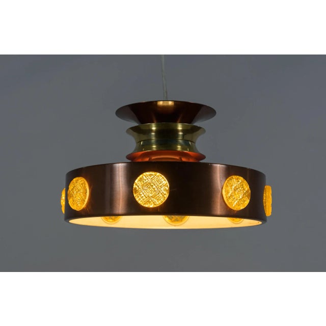 Scandinavian ceiling lamp made of copper with glass elements. Produced in the 1960s in Denmark. The lamp is in good...
