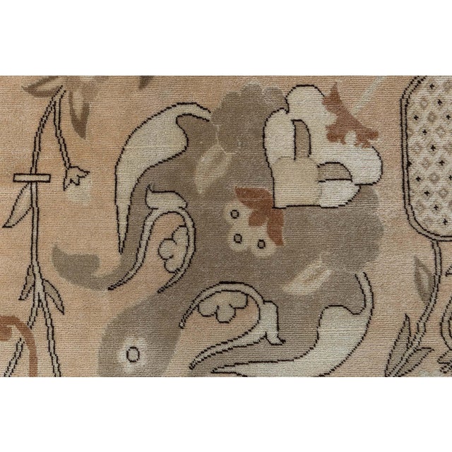 This hand-knotted wool rug draws inspiration from the rich heritage of Tabriz weaving, reinterpreting its classic motifs...